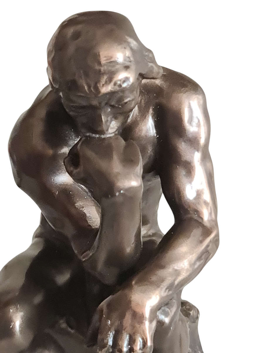 "THE THINKER" figurine. Signed
