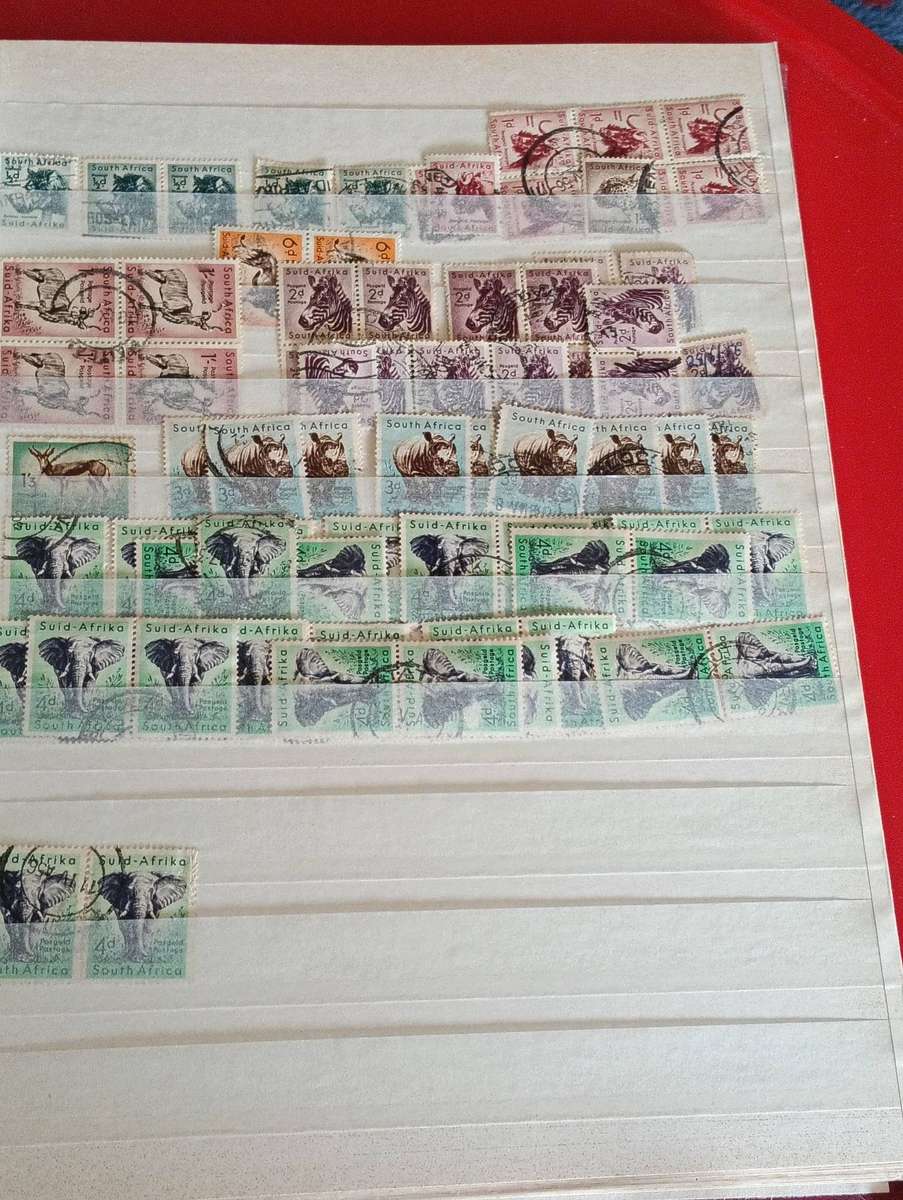 LEUCHTTURM" STAMP ALBUM AND SOME PAGES S A STAMPS.