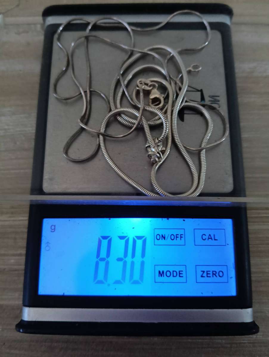 SILVER NECKLACES, WITH CLAW PENDANT.