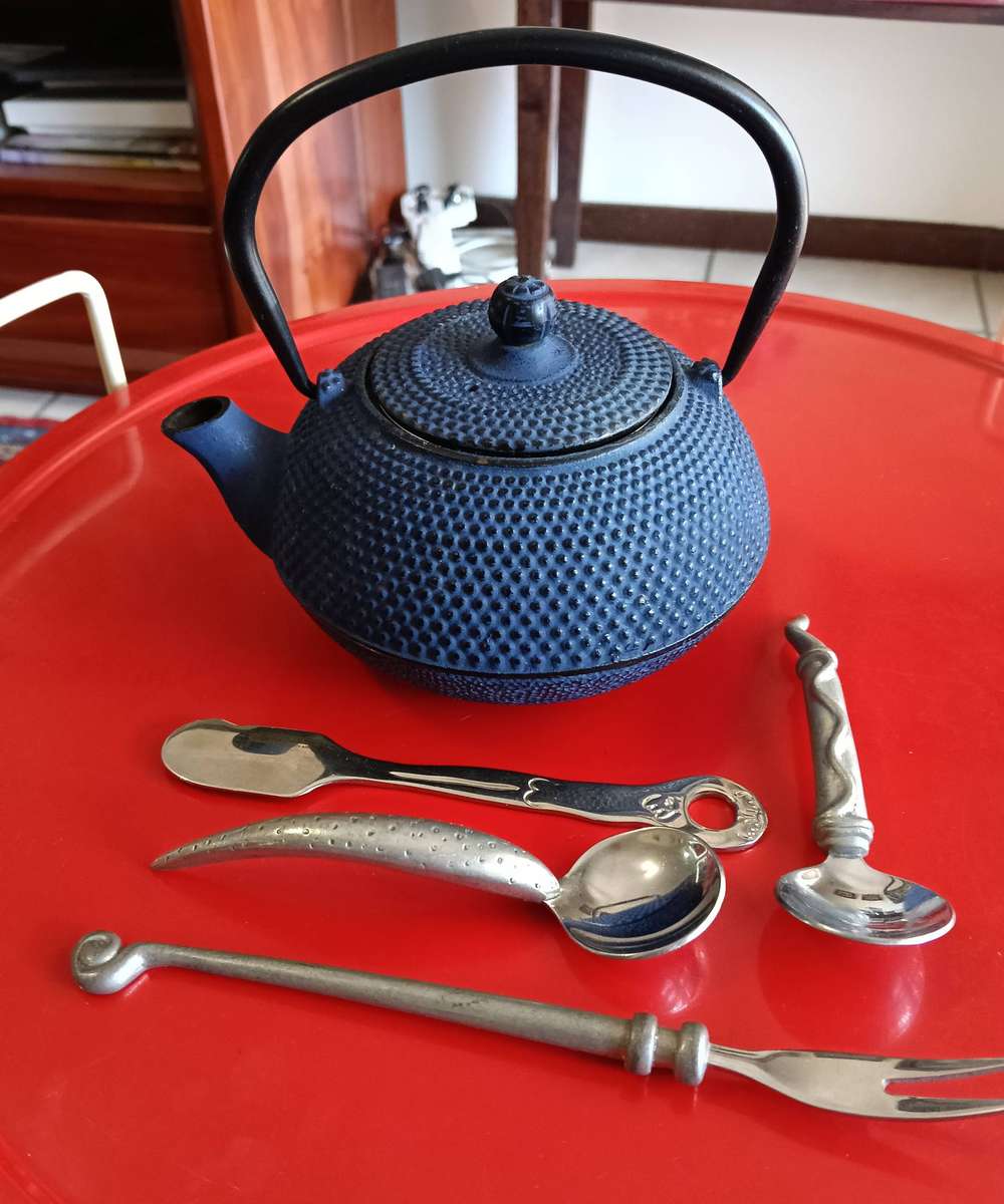 CAST IRON TEA POT. AND C BOYES ITEMS.