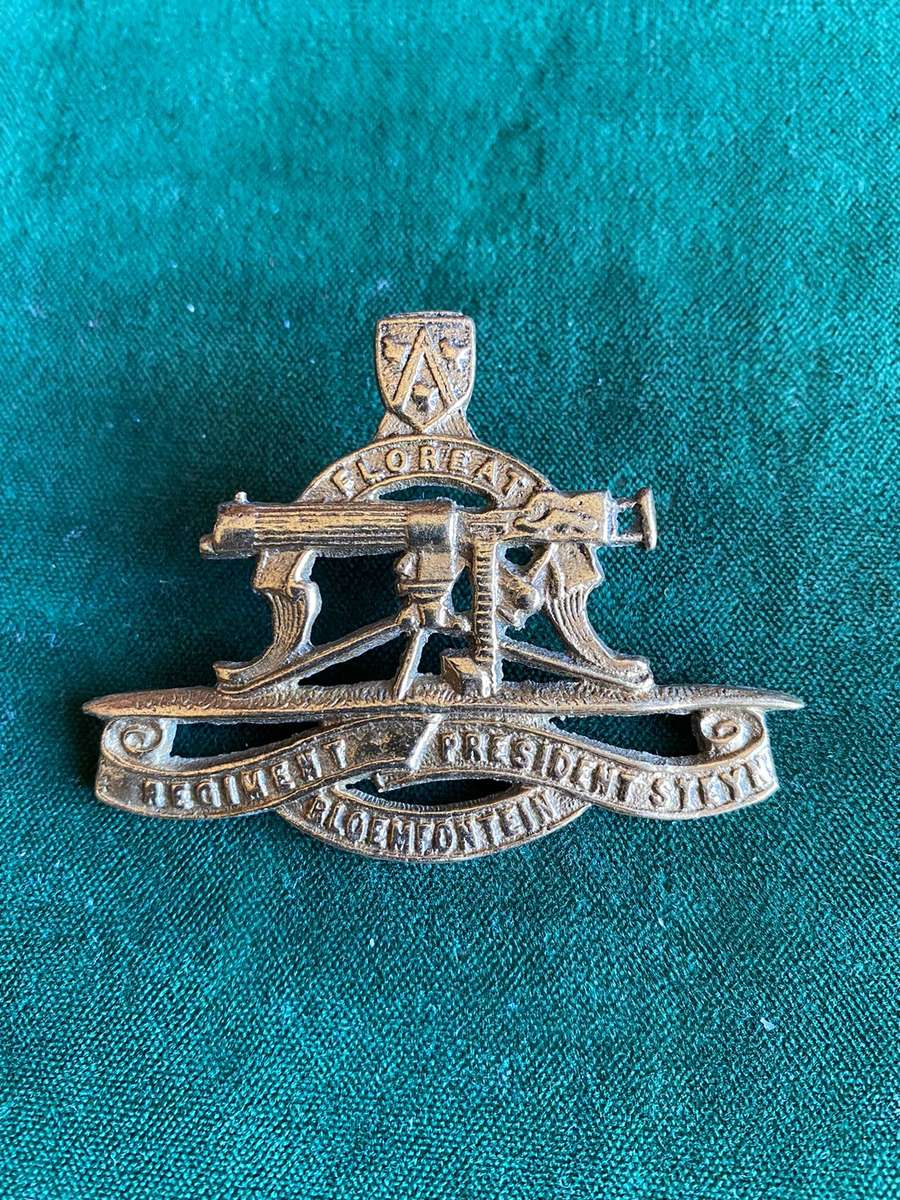 REGT. PRESIDENT STEYN CAST CAP BADGE-WORN WW2- 2 LUGS