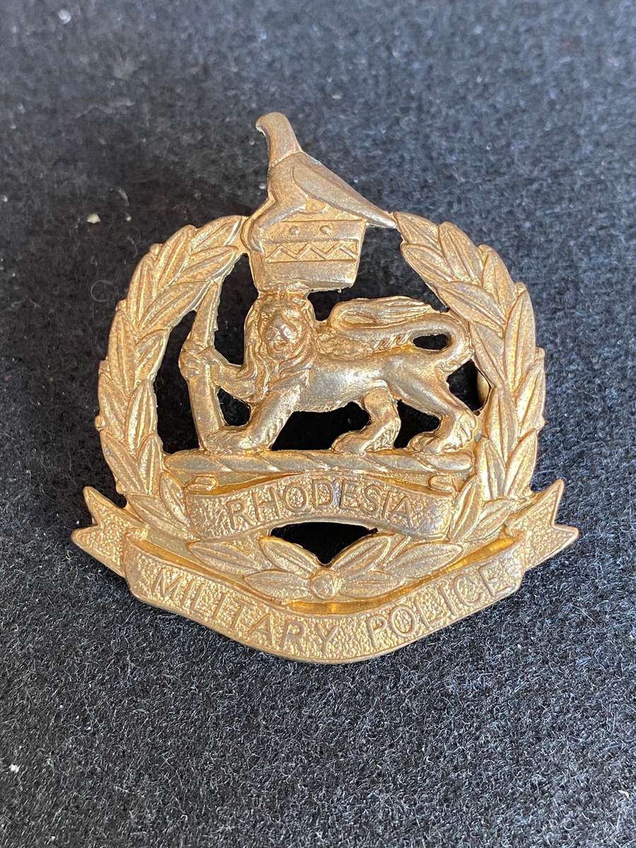 RHODESIA CORPS OF MILITARY POLICE ANODISED COLLAR BADGE-WORN 1970-80- 2 LUGS