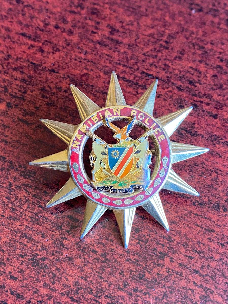 NAMIBIAN POLICE BADGE-WORN ON DRESS CAP OF PRESIDENTS MOTOR CYCLE OUTHRIDERS- 2 LUGS