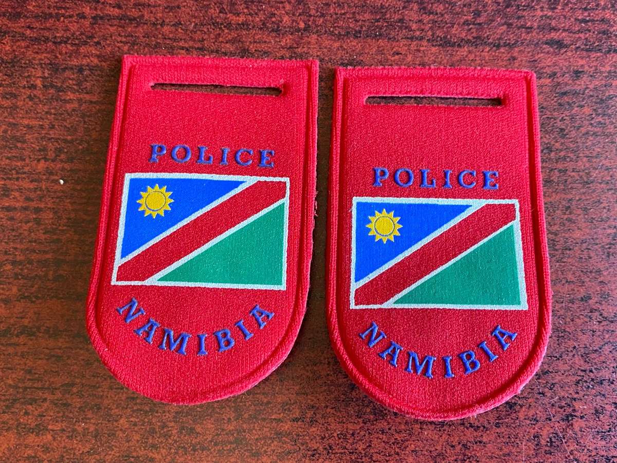 NAMIBIA POLICE TUPPER FLASH PAIR-(SMALLER TYEP) PINS COMPLETE