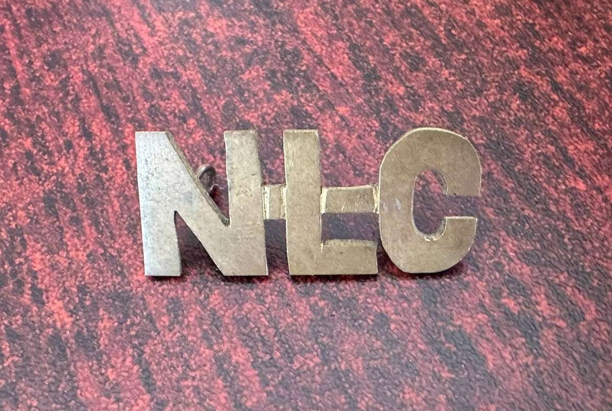 Native labour corps,brass sheet metal title. Worn WW1.