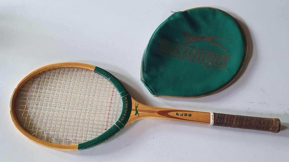 Vintage SLAZENGER PLUS -made in SA- wooden tennis racket with cover as per photo.