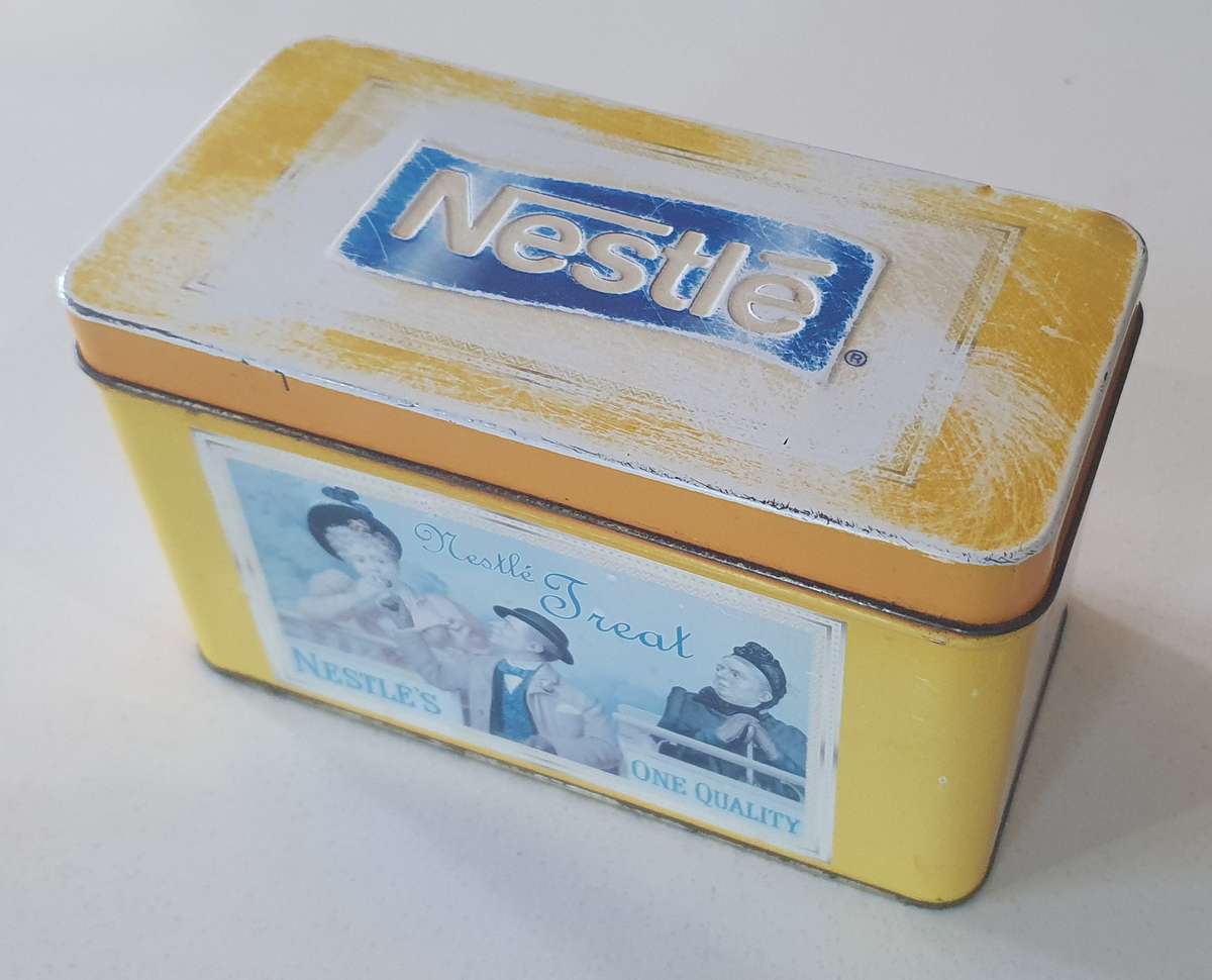 NESTLE tin as per photo