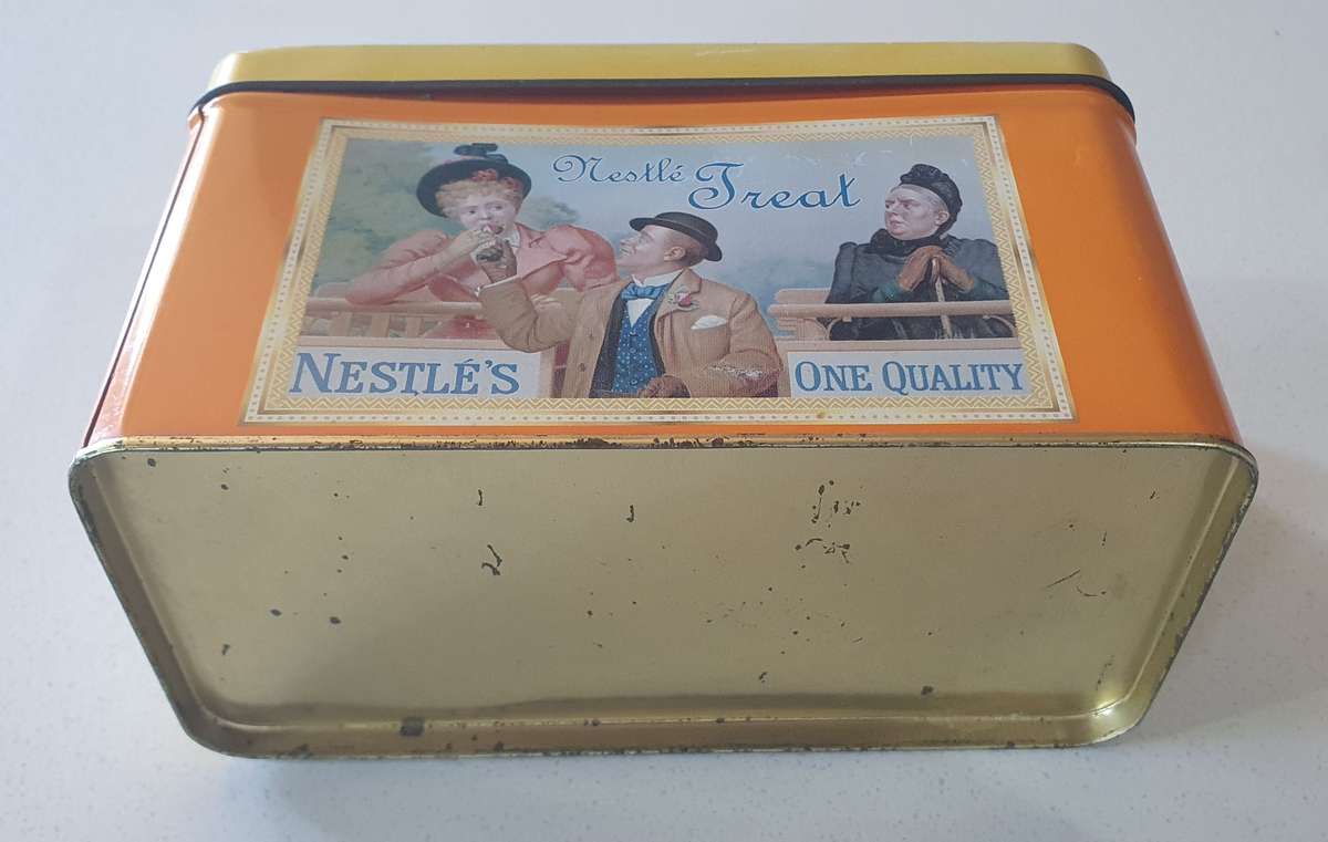 NESTLE tin as per photo