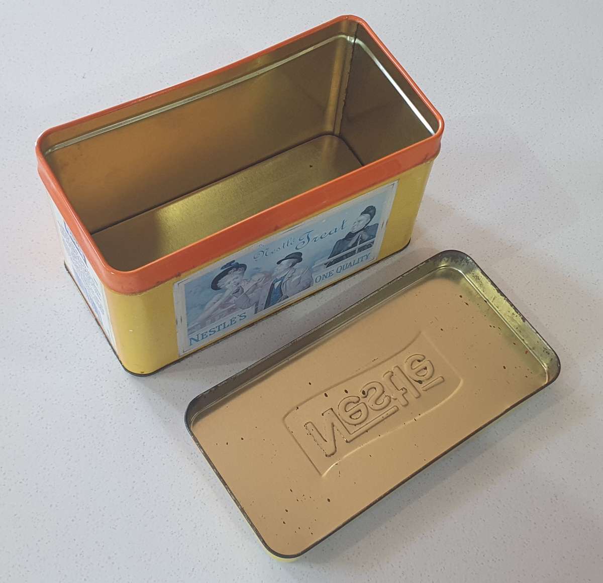 NESTLE tin as per photo