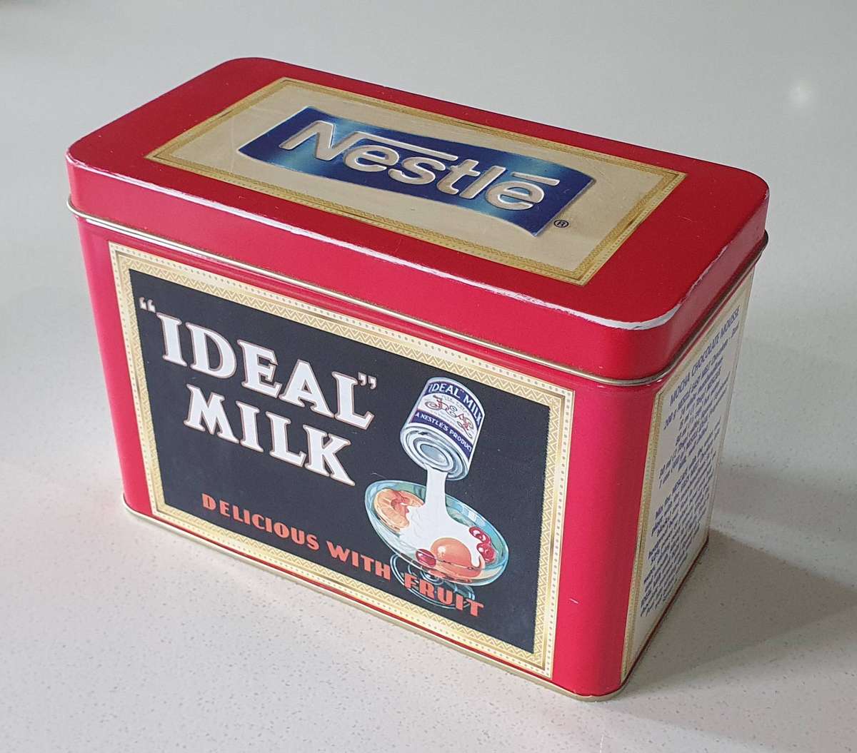 NESTLE tin as per photos