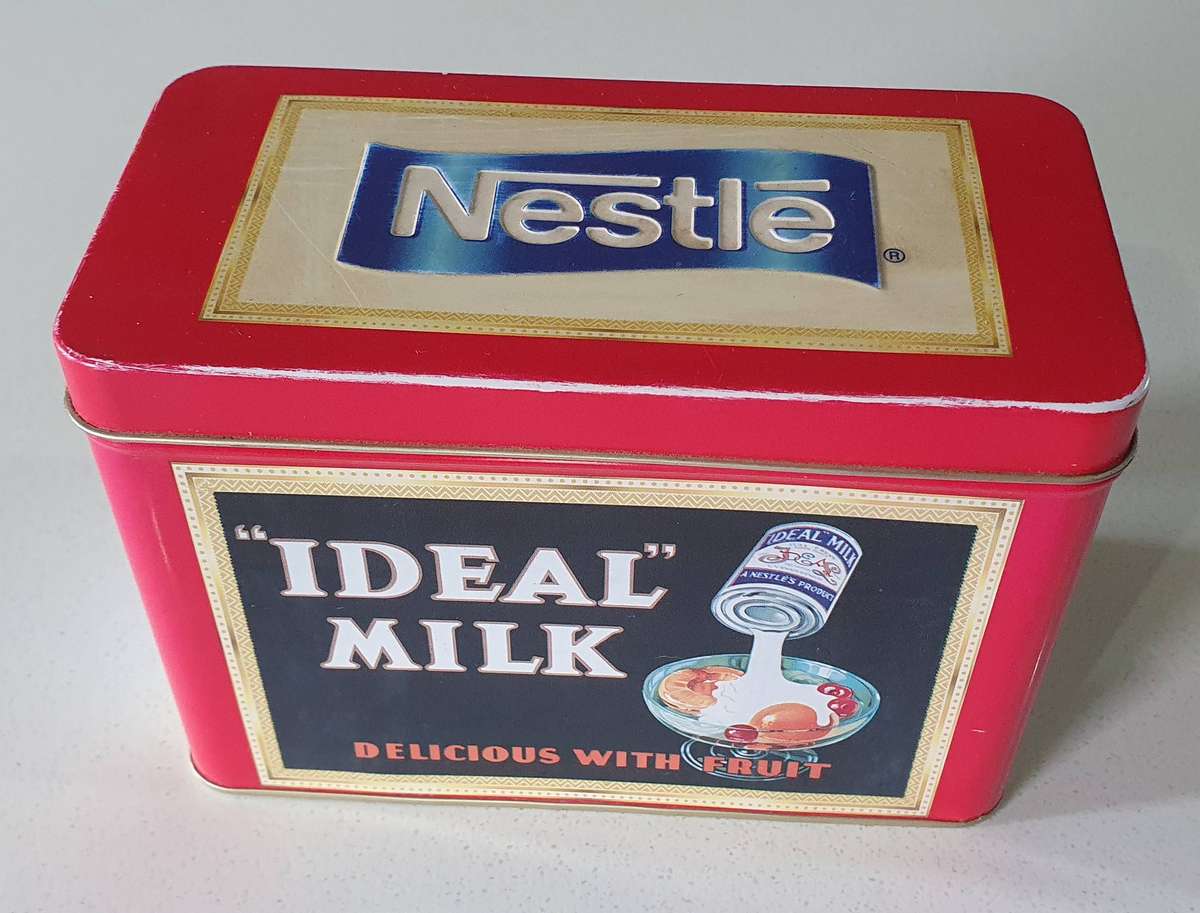 NESTLE tin as per photos