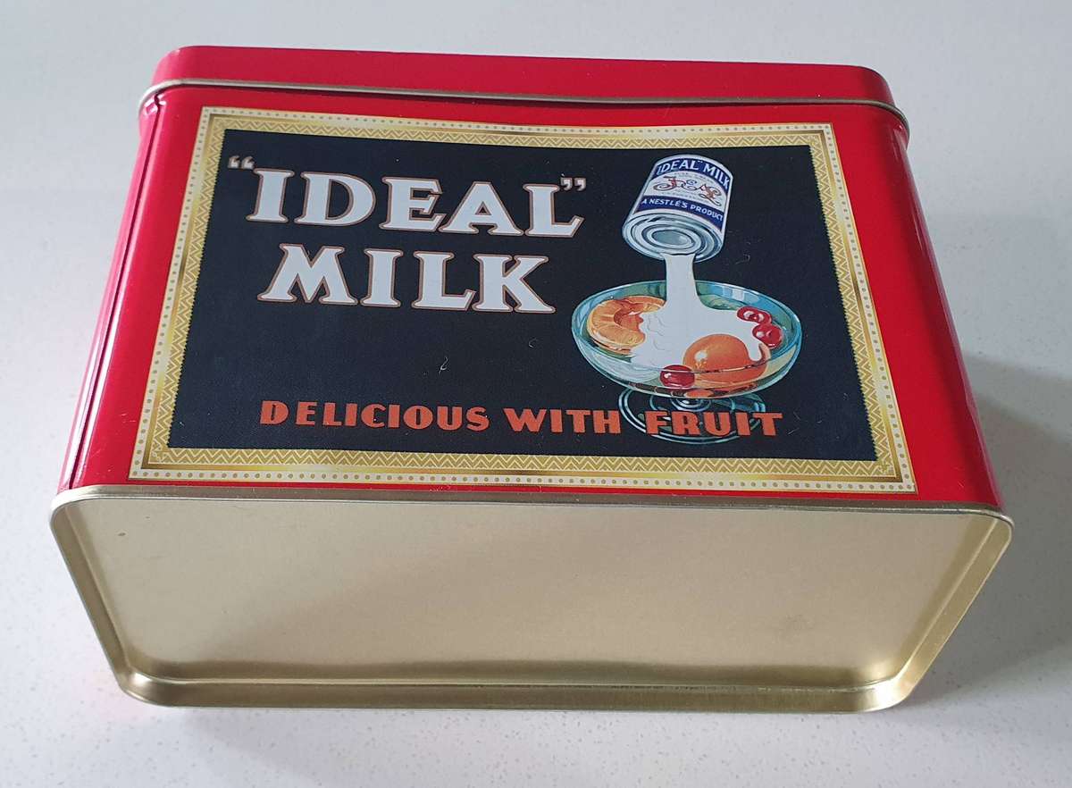 NESTLE tin as per photos