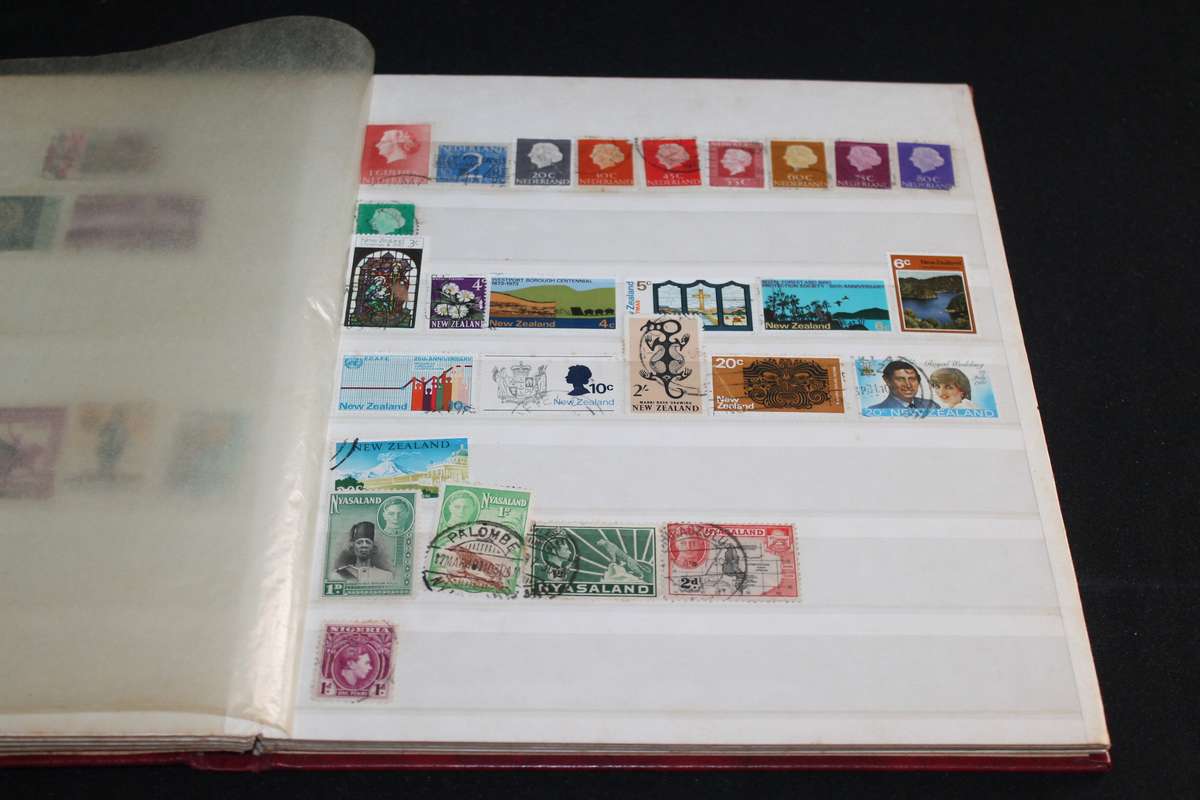 Album with Assorted Stamps Over 400 stamps