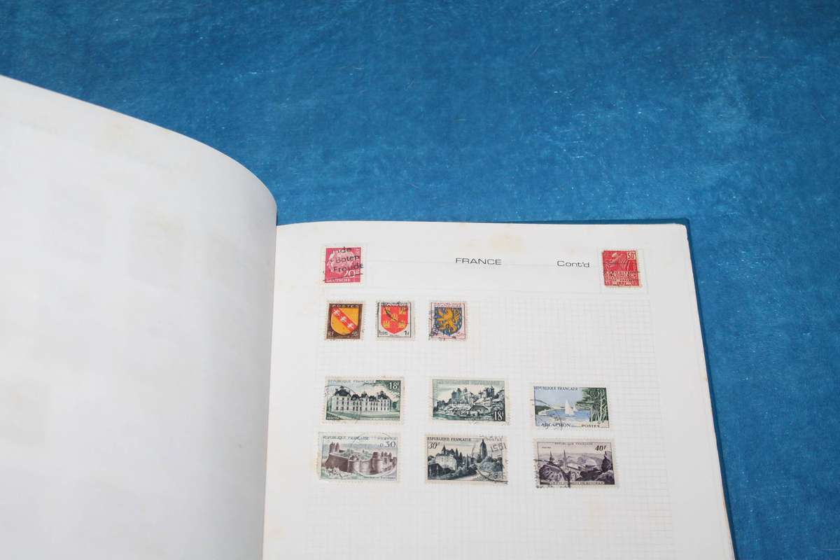 Stamp Album with over 200 assorted stamps
