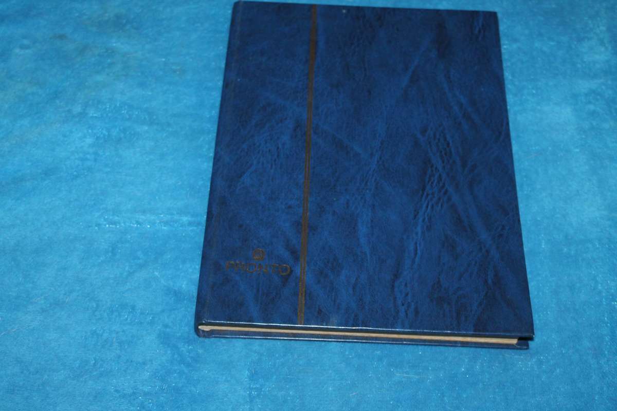 Stamp Album with over 300 assorted stamps