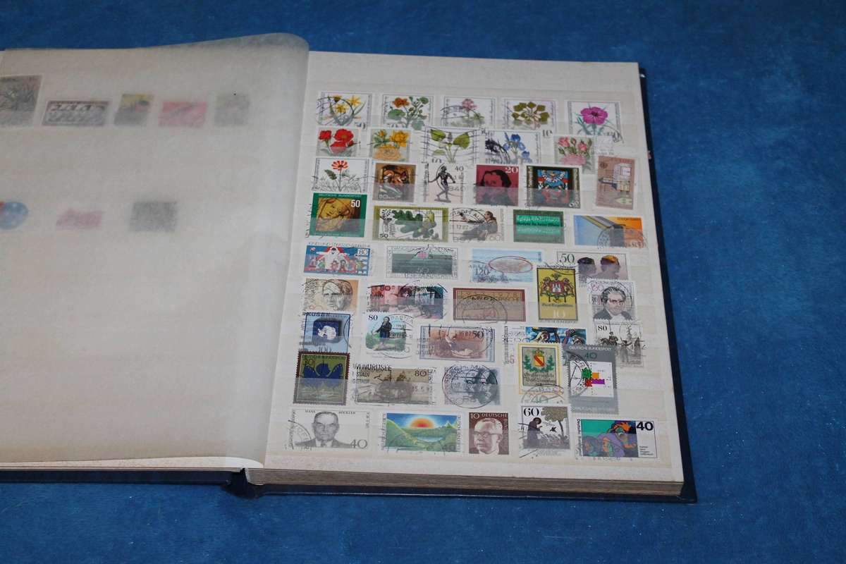 Stamp Album with over 300 assorted stamps
