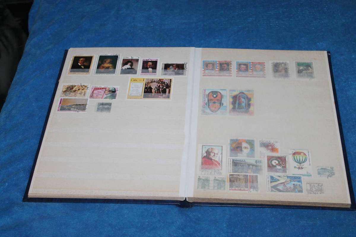 Stamp Album with over 300 assorted stamps