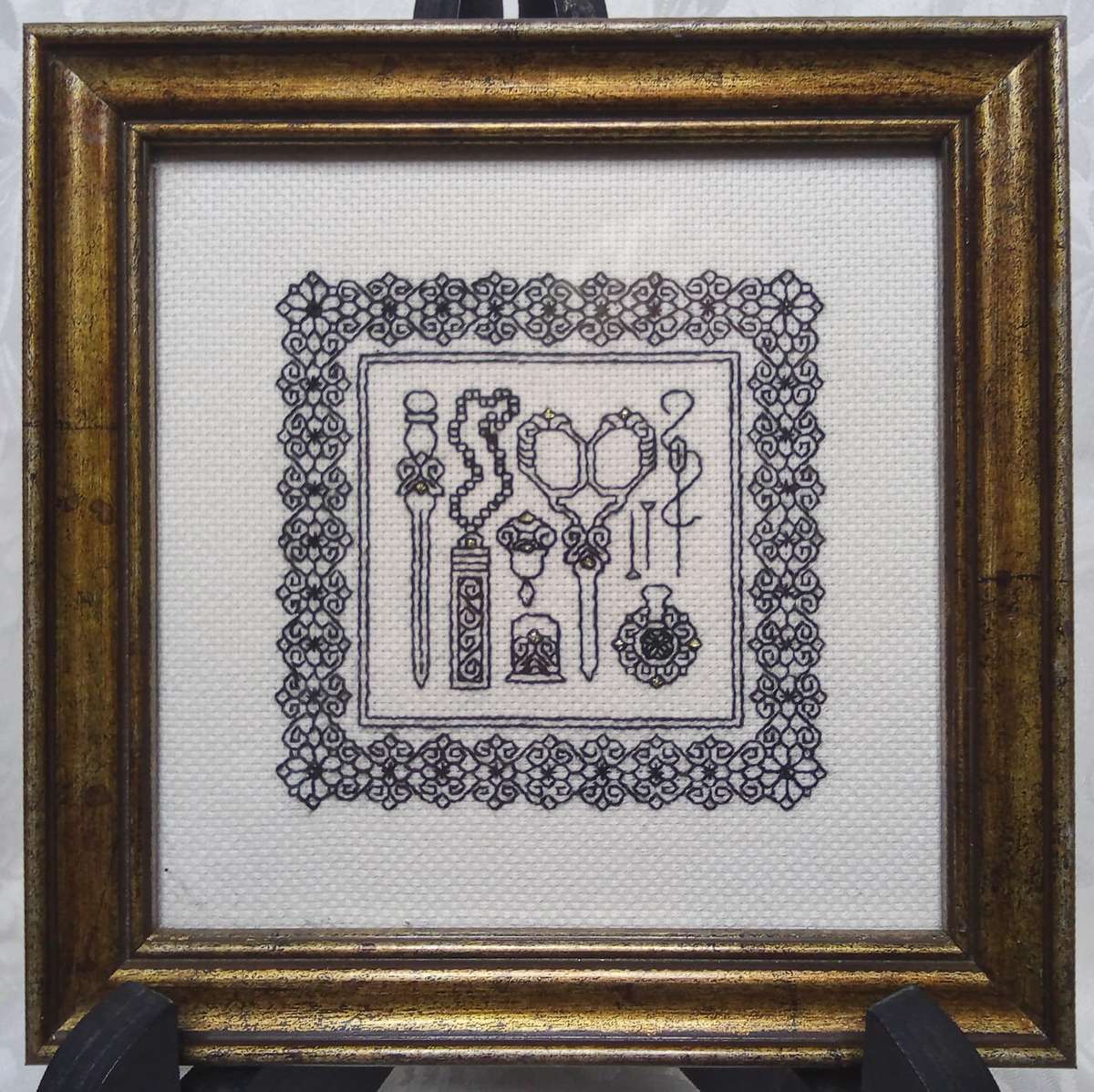 A gorgeous framed miniature embroidery