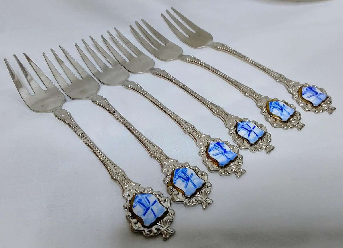 Six lovely cake forks