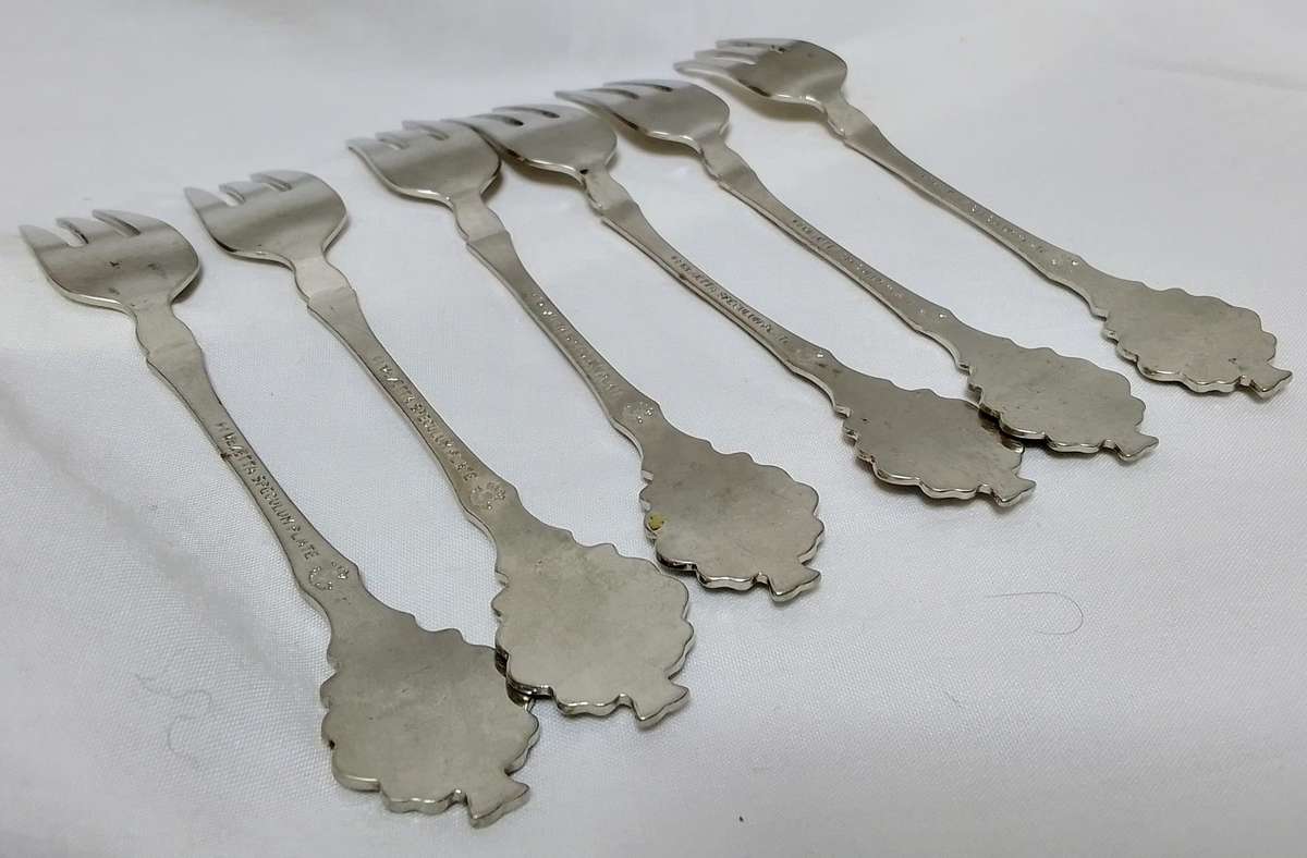 Six lovely cake forks