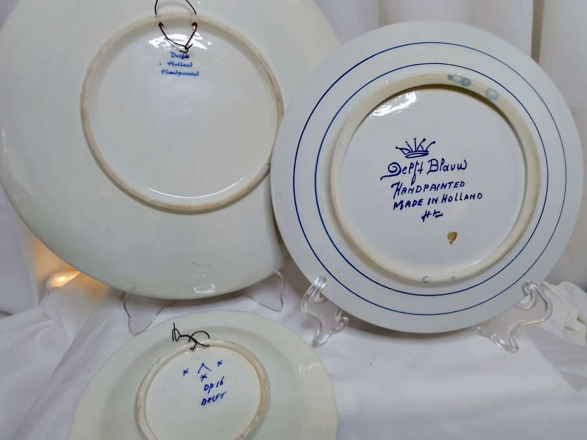 Three beautiful vintage handpainted Delft plates