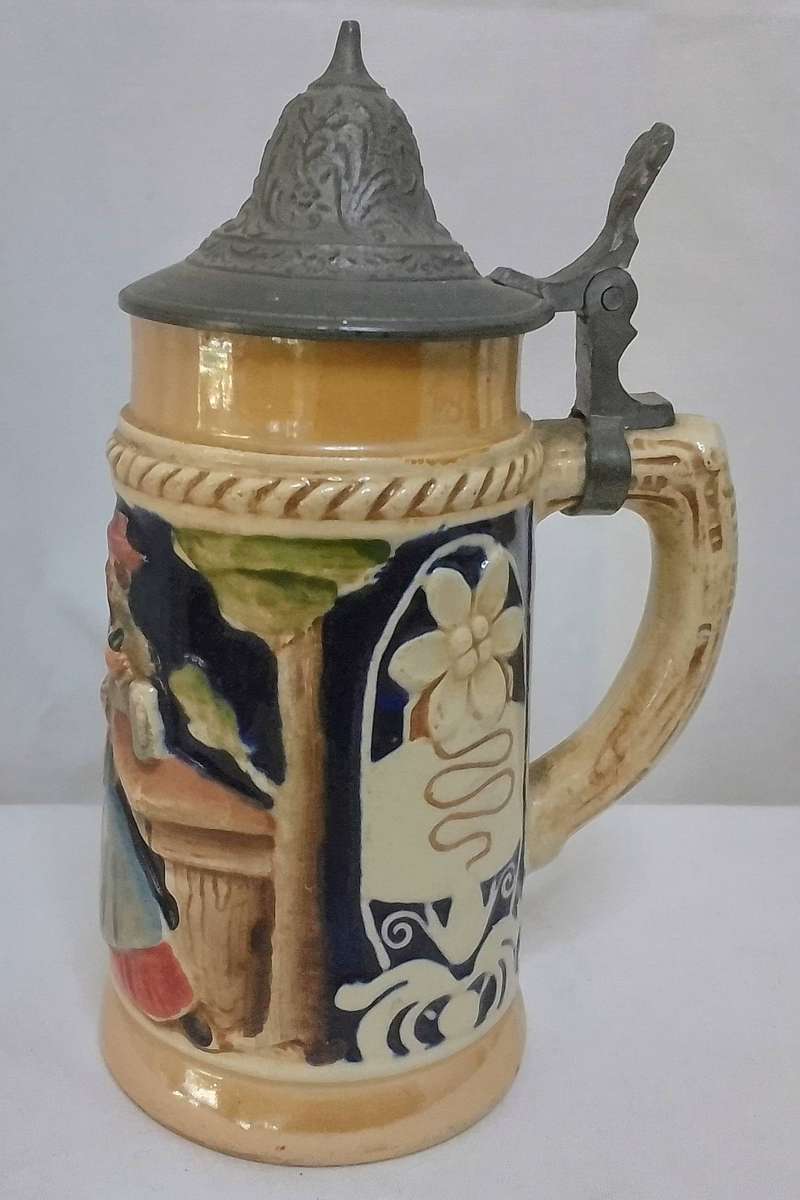 Stunning small vintage German beer stein with pewter lid