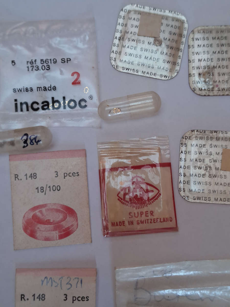 Lot of watch spares jewels springs settings Incabloc Favotite etc as per pictures
