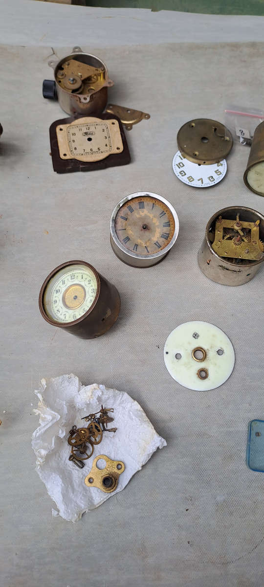 collection of small vintage clock movements for spares or repairs