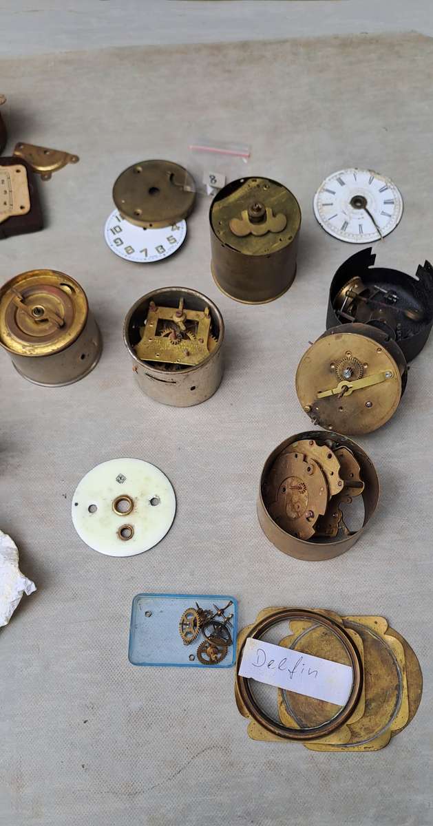 collection of small vintage clock movements for spares or repairs