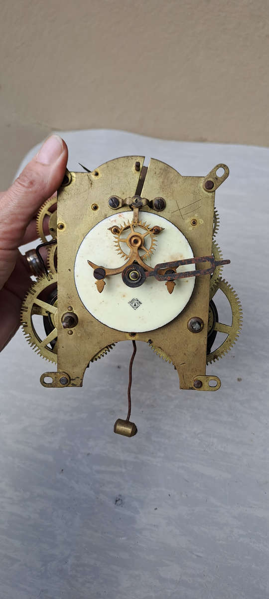 Ansonia open escarpment clock movement looks complete