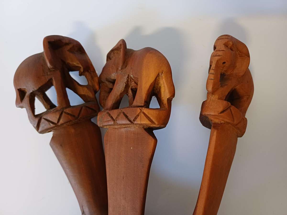 African dish on hand-carved wooden tripod with elephants