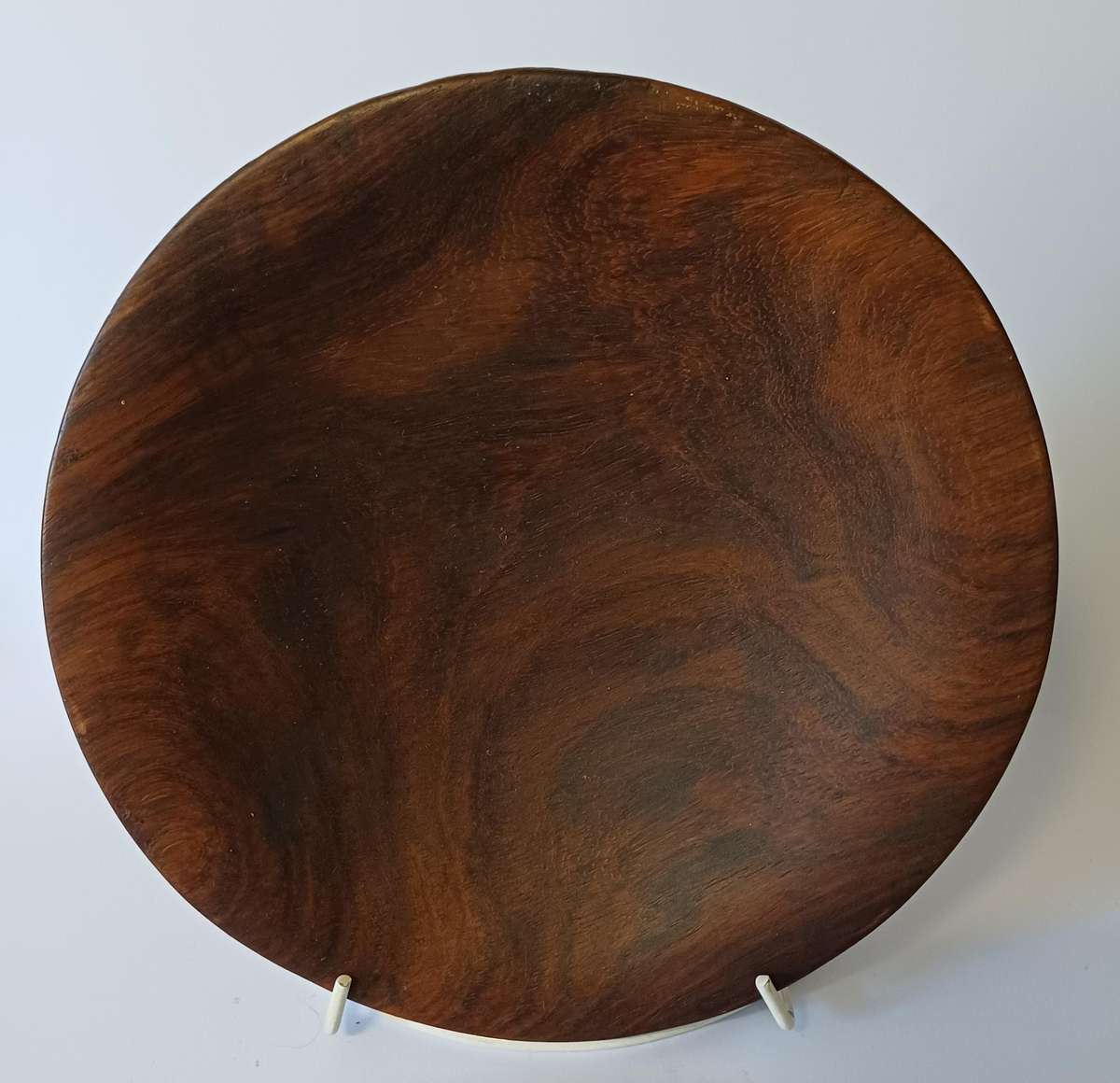 African dish on hand-carved wooden tripod with elephants