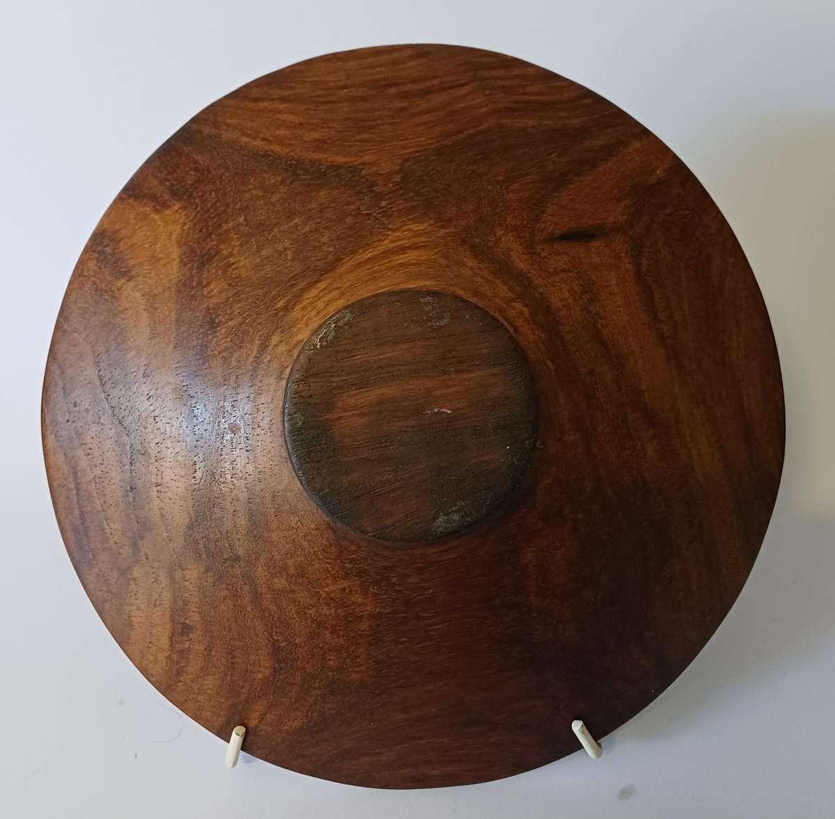 African dish on hand-carved wooden tripod with elephants