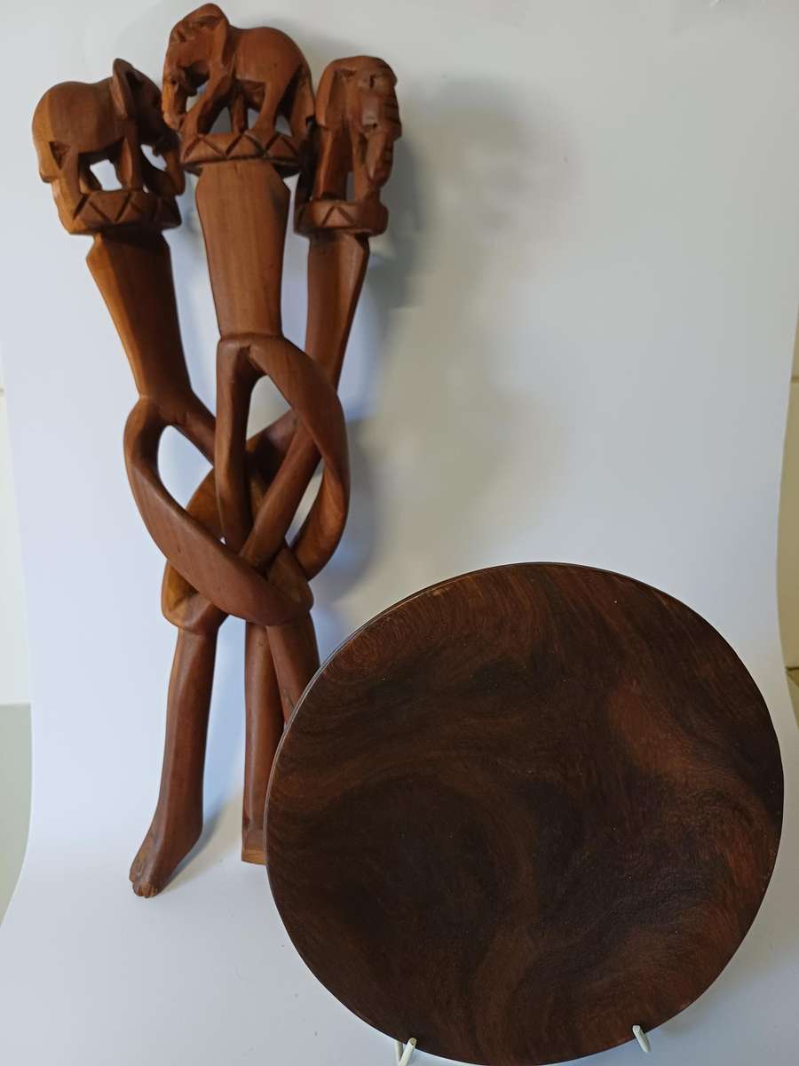African dish on hand-carved wooden tripod with elephants