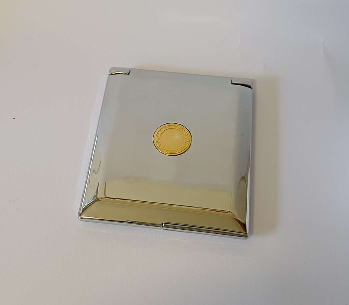 make-up mirror in chrome casing