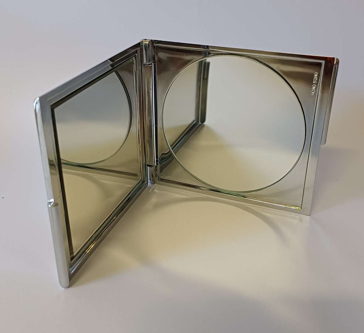 make-up mirror in chrome casing