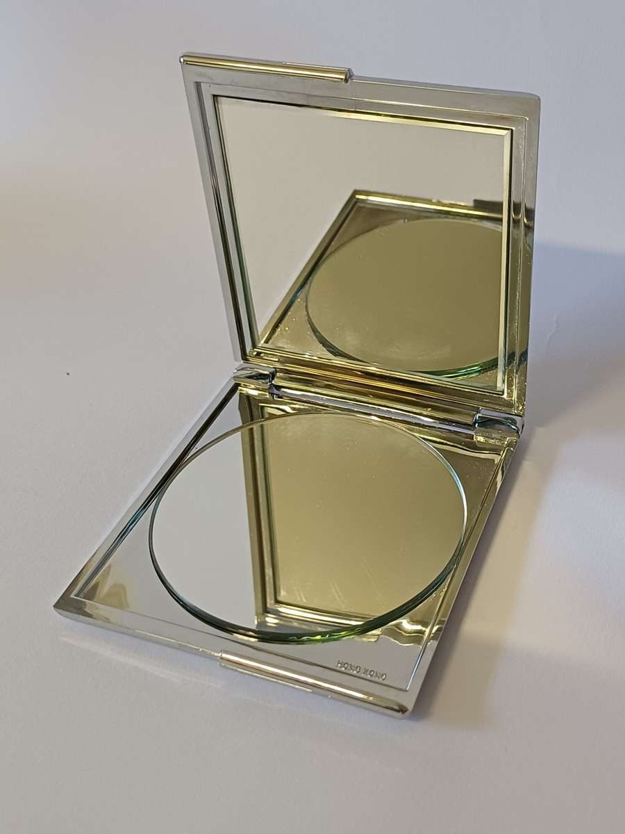 make-up mirror in chrome casing