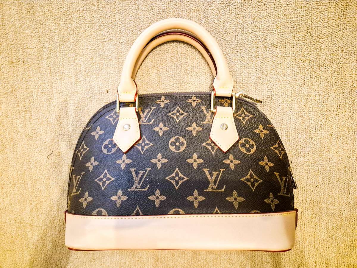 Louis Vuitton Alma BB Monogram Handbag
