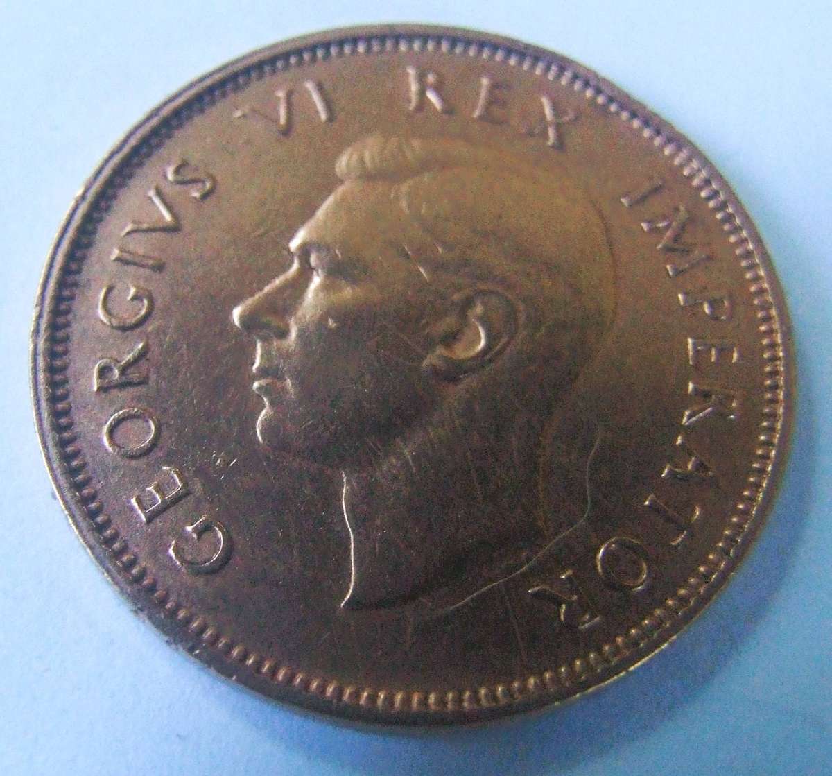 MINT ERROR ,WEAK STRIKE ON HALF OF FRONT ,, 1938 1/2 PENNY
