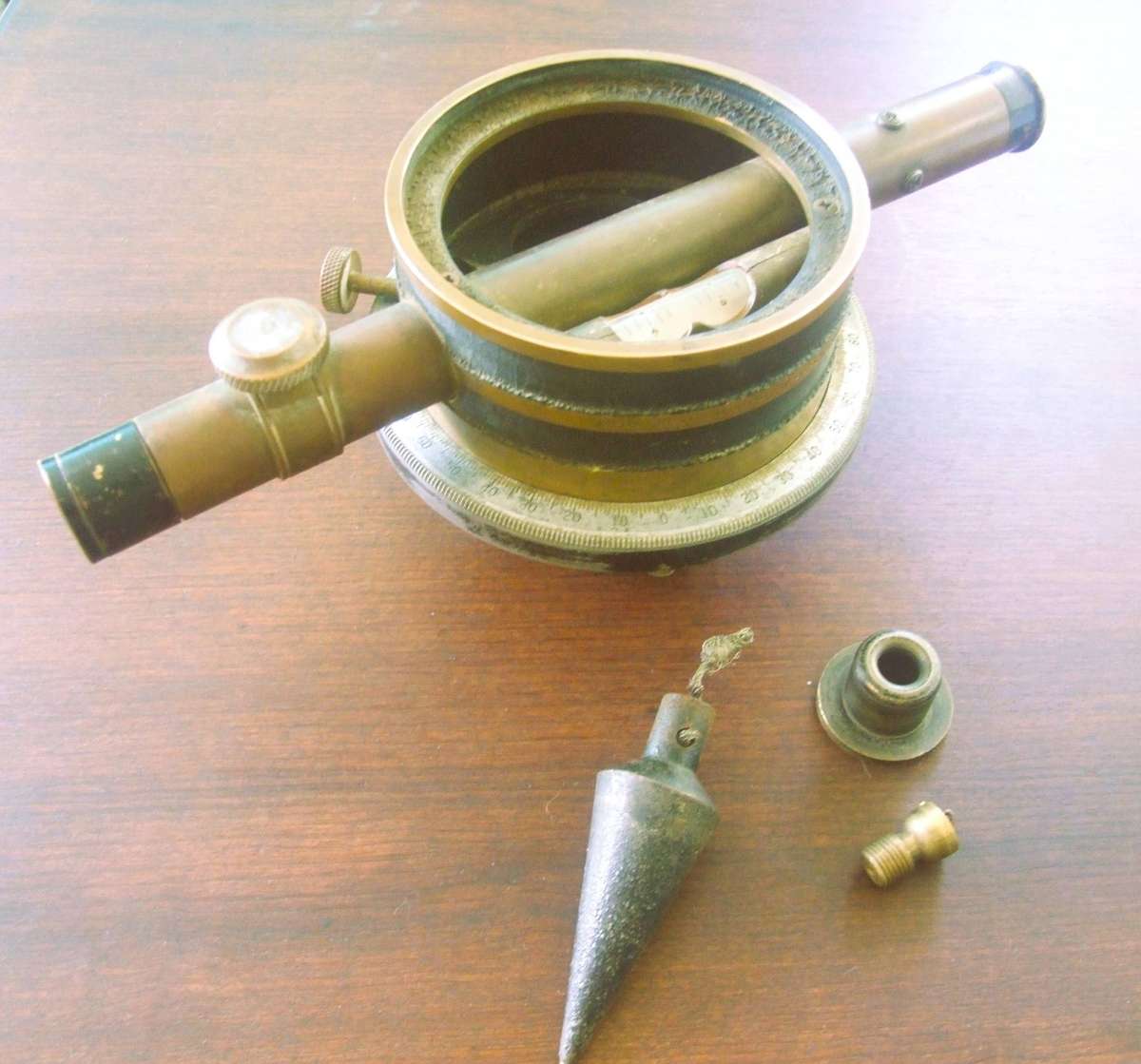 a vintage surveying instrument, specifically identified as a Bostrom Model 4 Contractors Transit Lev