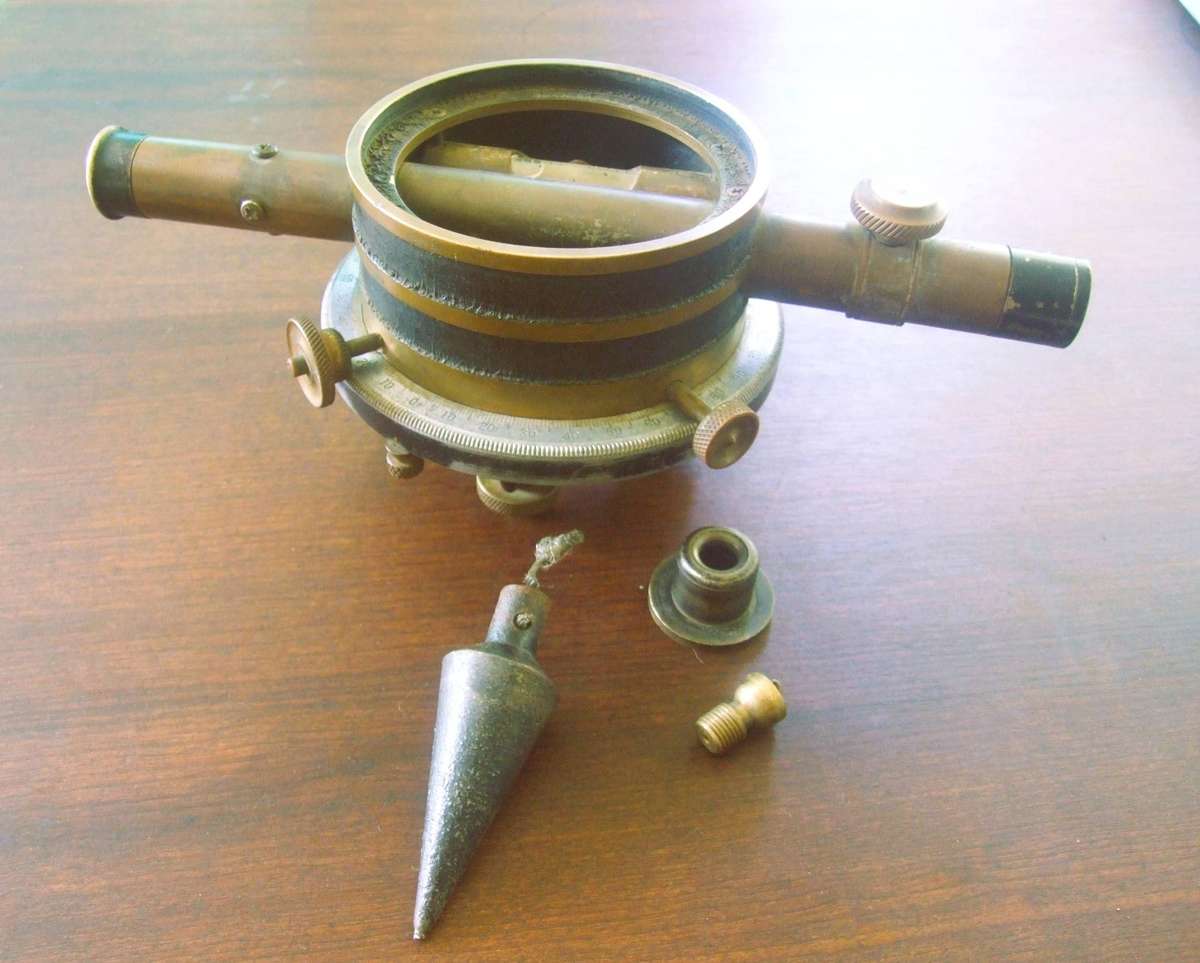 a vintage surveying instrument, specifically identified as a Bostrom Model 4 Contractors Transit Lev