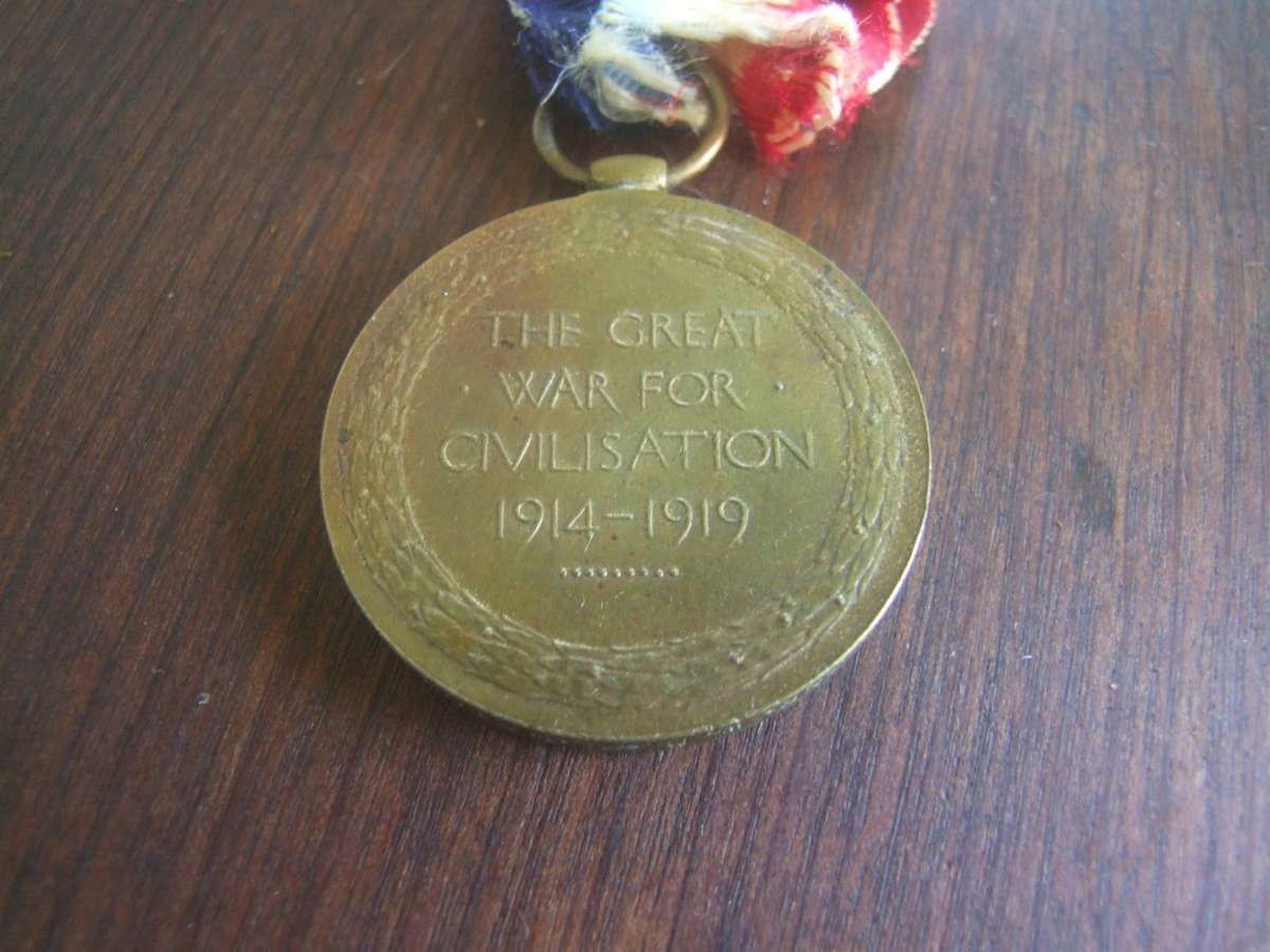@    an original  World War I Victory Medal,  the South African version, which features a wing