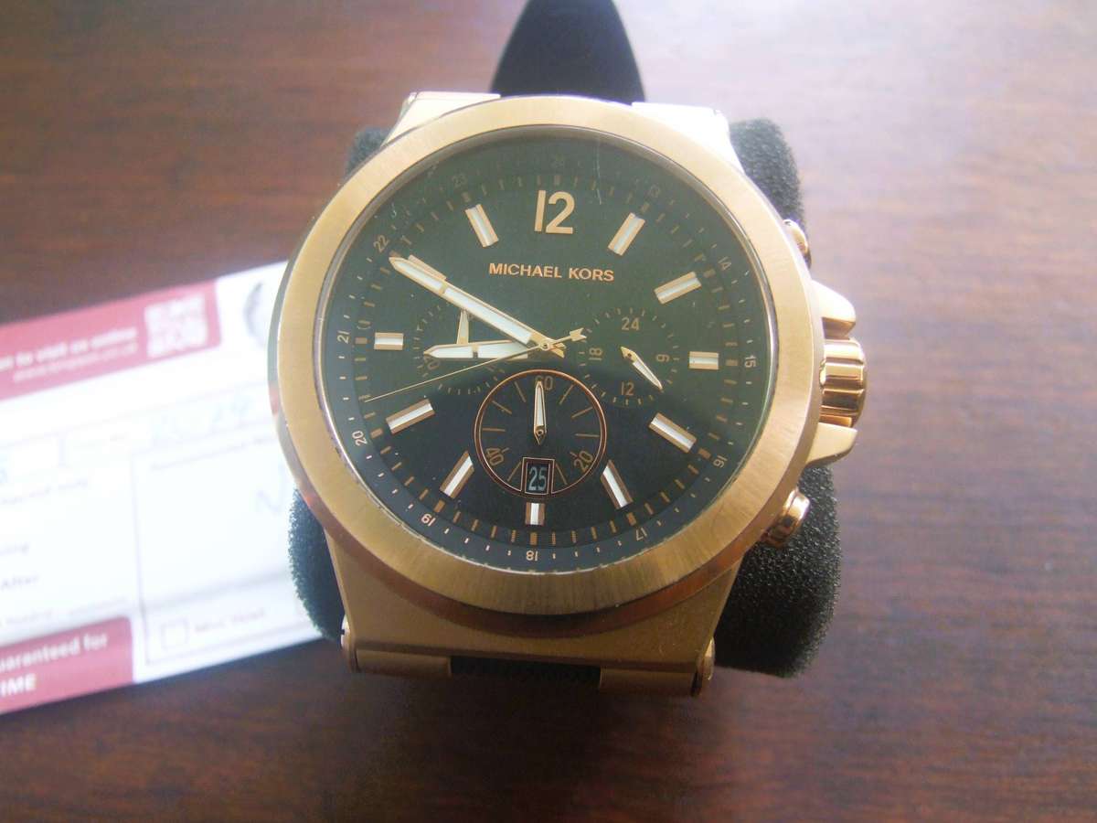 Michael Kors Dylan Chronograph Watch (Model MK8184). It is characterized by its bold rose gold-tone