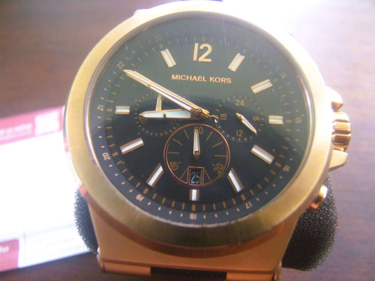 Michael Kors Dylan Chronograph Watch (Model MK8184). It is characterized by its bold rose gold-tone