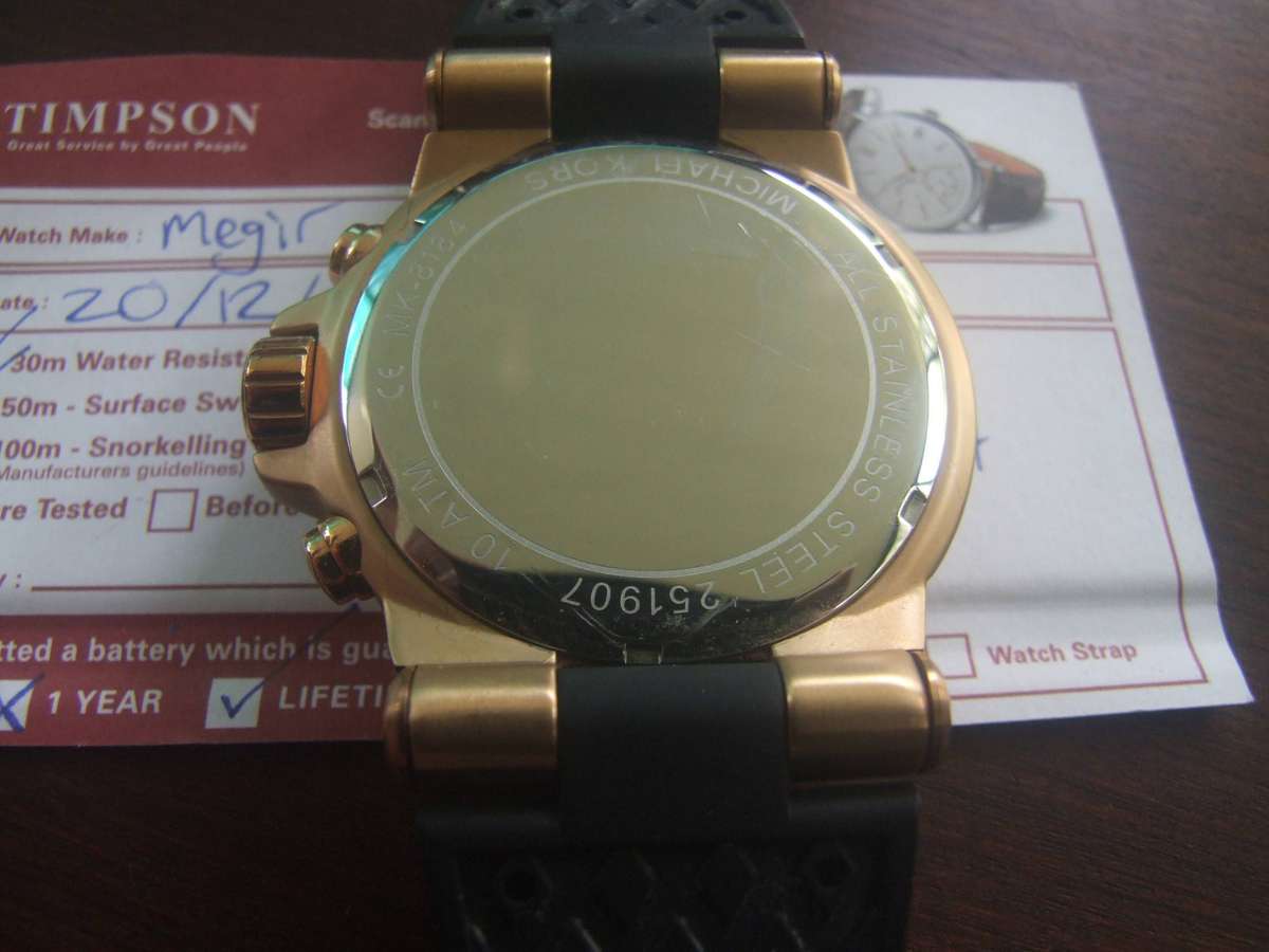 Michael Kors Dylan Chronograph Watch (Model MK8184). It is characterized by its bold rose gold-tone