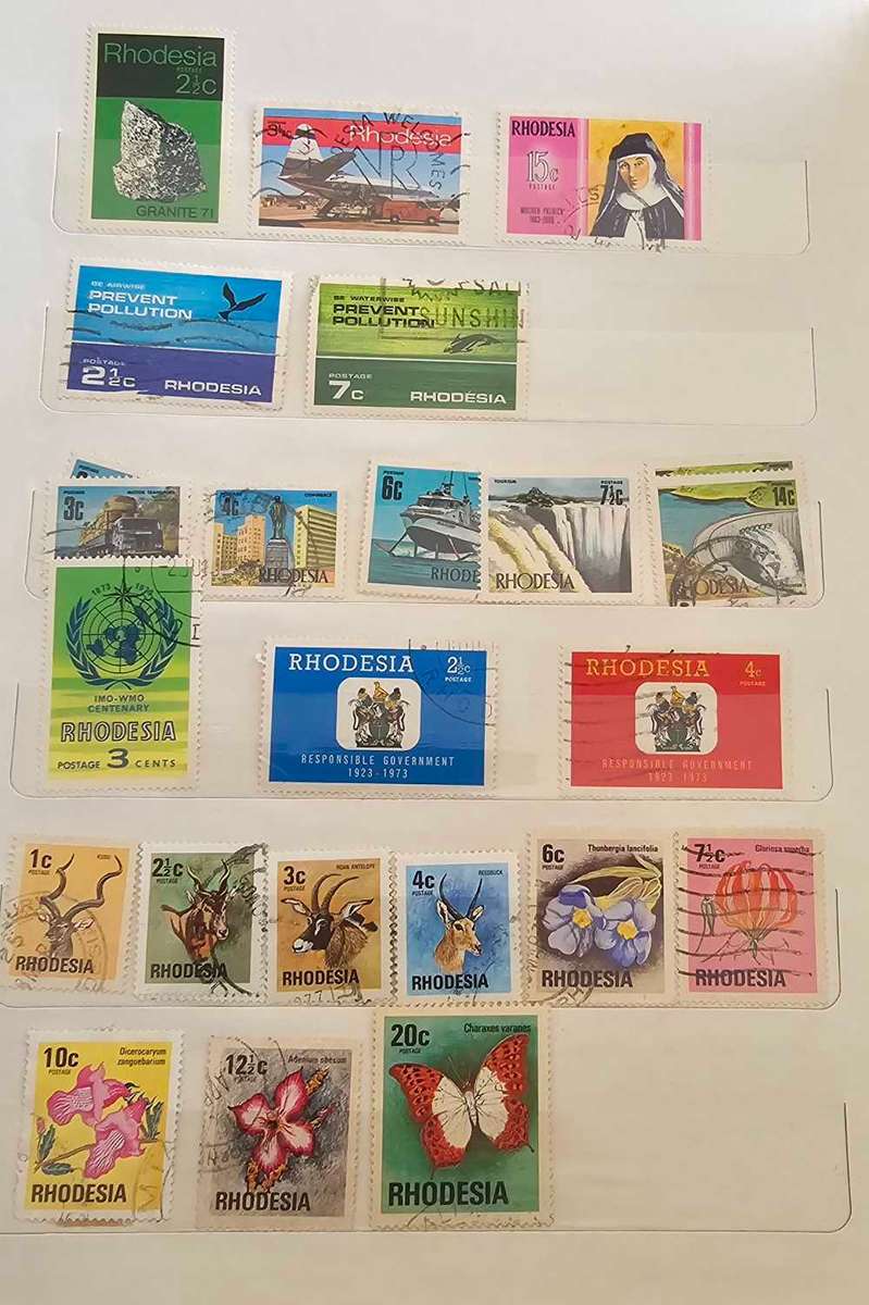 African stamps in abundance with a free album included