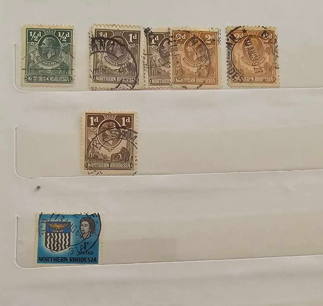 African stamps in abundance with a free album included