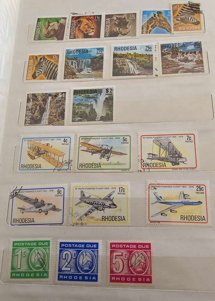 African stamps in abundance with a free album included