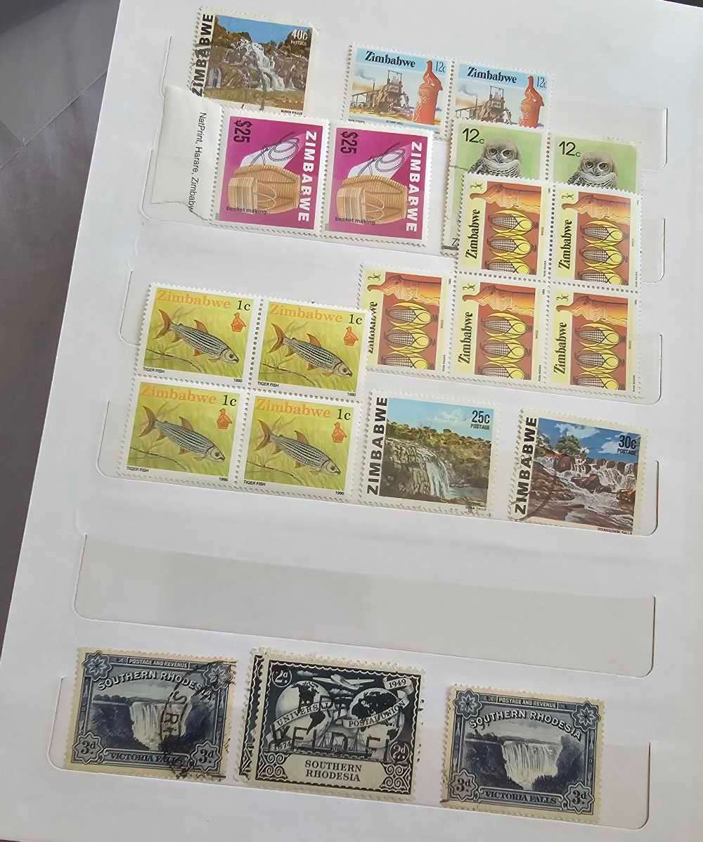 African stamps in abundance with a free album included