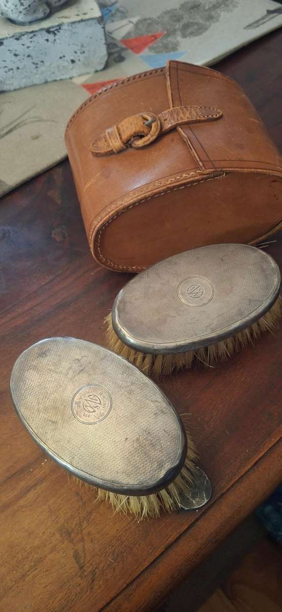 Vintage Sterling Silver brushes in leather case